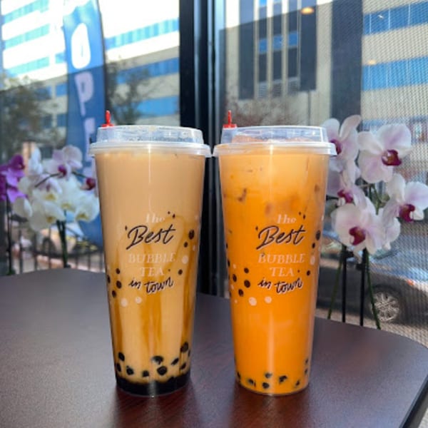 Two bubble teas, one light brown and one orange, with "The Best Bubble Tea in Town" text.